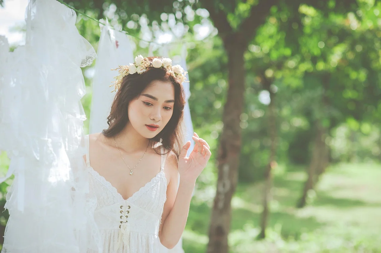 Young Filipina woman contemplating between renting and buying a debut gown, weighing financial decisions